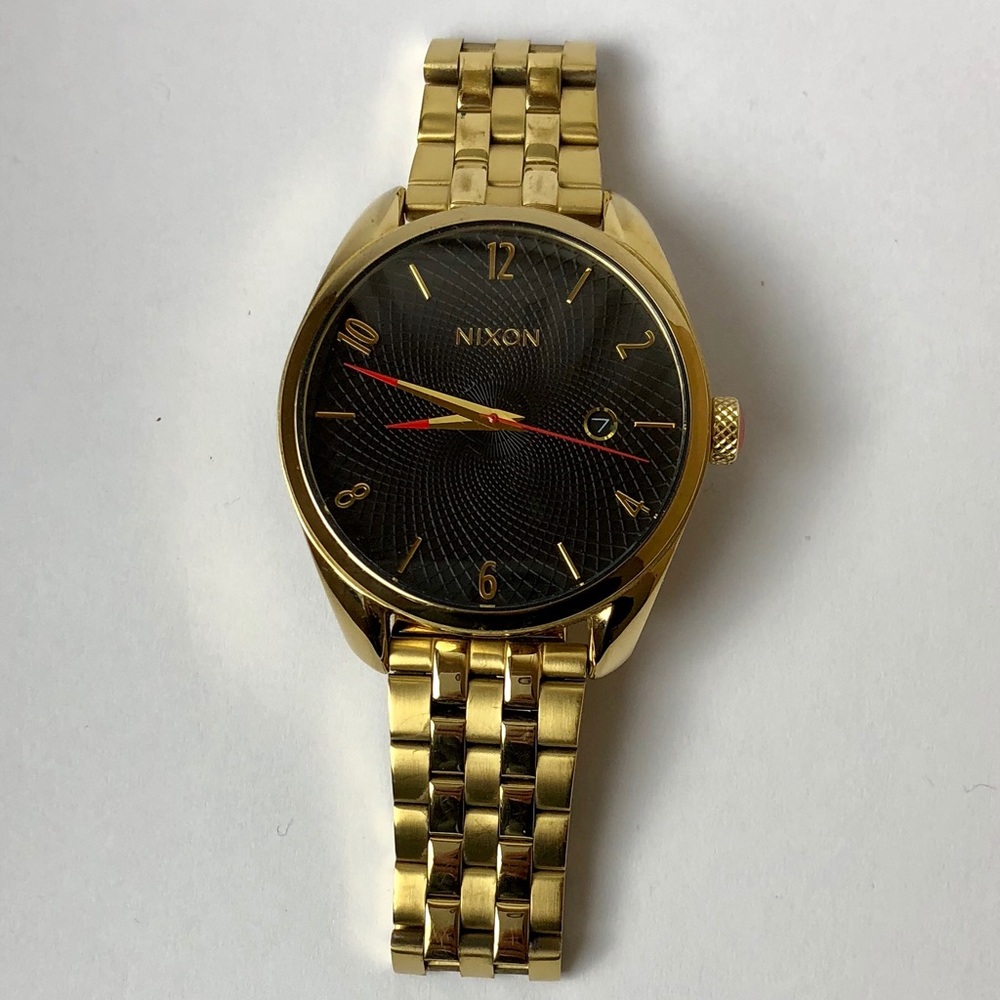 Gold Nixon the bullet analog watch